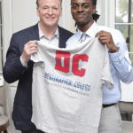 NFL Commissioner Roger Goodell is presented with a t.shirt designed and created by a Destination: College 2025 Cooney Scholarship awardee at the 2025 Best Night of The Year event.