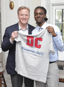 NFL Commissioner Roger Goodell is presented with a t.shirt designed and created by a Destination: College 2025 Cooney Scholarship awardee at the 2025 Best Night of The Year event.