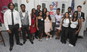 A photo of NFL Commissioner Roger Goodell with Destination: College student-athletes and 2025 Cooney Scholars at the Destination: College 2025 fundraiser Best Night of The Year